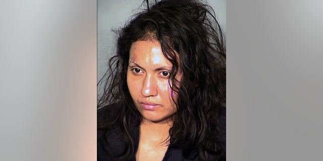 FILE - This undated booking photo provided by the Las Vegas Metropolitan Police Department shows Robledo Ibarra, 34, who faces felony charges after police say she tossed her two young children and herself out a second-story window on June 12, 2014. Ibarra was in a wheelchair Monday, June 30, 2014 for her initial court appearance in Las Vegas on two attempted counts of murder and two charges of child abuse causing substantial bodily harm. Her lawyer, Benson Lee, says he intends to file written documents seeking her release on bail from the Clark County jail. (AP Photo/Las Vegas Metropolitan Police Department,File)