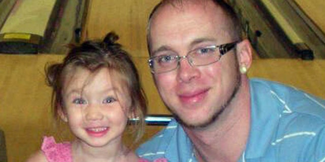 Jordan Arwood is seen with his daughter Chloe. Chloe and her cousin James Levi Caldwell were buried alive and died as a wall of dirt collapsed on them Sunday April 7, 2013.