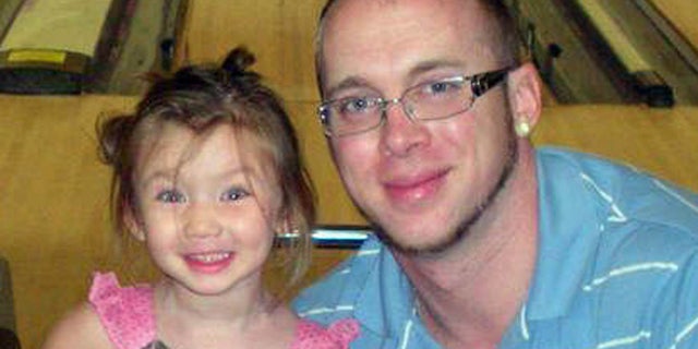Jordan Arwood is seen with his daughter Chloe. Chloe and her cousin James Levi Caldwell were buried alive and died as a wall of dirt collapsed on them Sunday April 7, 2013.
