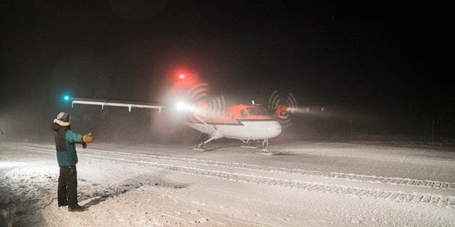 Twin Otter aircraft on a medical evacuation flight taxis on the skyway at NSF's Amundsen-Scott South Pole Station.