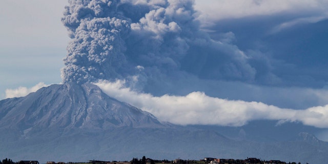 A thick plume pours from the Calbuco volcano, near Puerto Varas, Chile, Thursday, April 30, 2015.