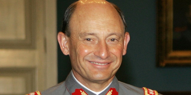 FILE - This Nov. 28, 2005 file photo, shows Chile's outgoing Army Chief Gen. Juan Emilio Cheyre at the government palace La Moneda, in Santiago, Chile. The former army chief acknowledged on Tuesday, Aug. 20, 2013, that he handed over to nuns the child of two left-wing activists killed after the 1973 military coup. Cheyre, who now heads Chile's electoral service, told the newspaper El Mercurio that he gave 2-year-old Ernesto Lejderman to a convent. In his first time speaking publicly about the case, he said that he was just following orders and that his conscience is clean. (AP Photo/Santiago Llanquin, File)