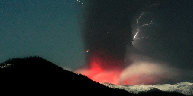 June 12: Lightning strikes over the Puyehue-Cordon Caulle volcano in Chile, seen from the international cross border way Cardenal Samore, in southern Chile. The volcano erupted June 4 after remaining dormant for decades.