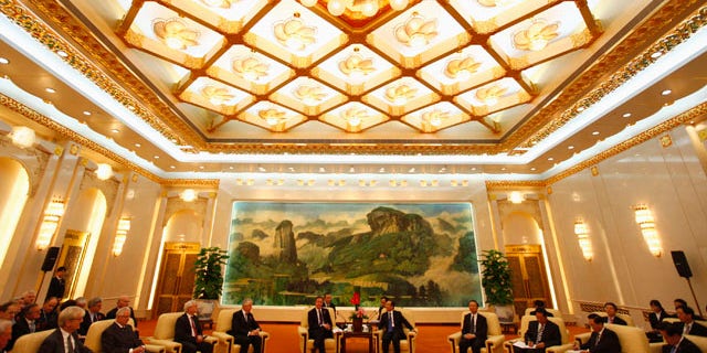 Nov. 9: Britain's Prime Minister David Cameron, center left, and China's Premier Wen Jiabao, center right, attend a meeting with British industrial and commercial business delegates at the Great Hall of the People in Beijing, China.