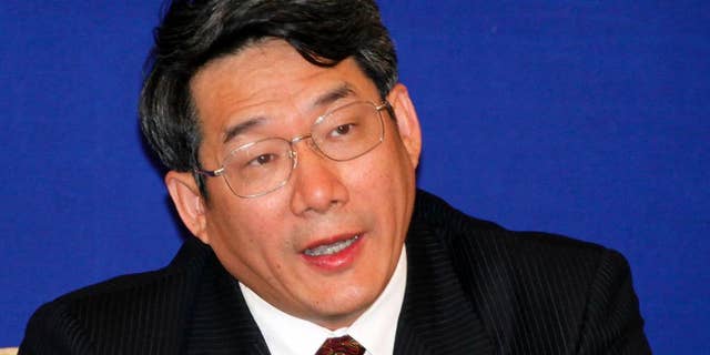 FILE - In this April 29, 2009 file photo, Liu Tienan, then the vice chairman of the National Development and Reform Commission, speaks during a press conference in Shanghai, China. The former deputy chief of the agency in charge of steering the world's second-largest economy went on trial Wednesday, Sept. 24, 2014, accused of taking bribes, China's official news agency said. (AP Photo/Eugene Hoshiko, File)
