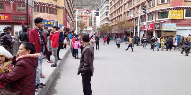 In this Saturday, Nov. 23, 2014 photo, injured people receive medical treatment at a hospital in Kangding County, Sichuan province, China. A strong earthquake that hit a sparsely populated, mountainous area of western China killed at least five people and injured more than 50 others, officials said Sunday. (AP Photo/Xinhua, Li Qiaoqiao) NO SALES