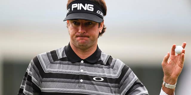 Bubba Watson of the U.S. greets spectators on the 4th hole during final round of the HSBC Champions golf tournament at the Sheshan International Golf Club in Shanghai, China, Saturday, Nov. 9, 2014. Watson captured his first World Golf Championship. (AP Photo)
