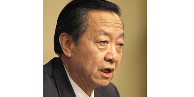 Li Yizhong, Chinese Minister of Industry and Information Technology, speaks during a press conference in Beijing Friday, March 12, 2010. Li, China's top Internet regulator, insisted Friday that Google must obey its laws or "pay the consequences," giving no sign of a possible compromise in their dispute over censorship and hacking.