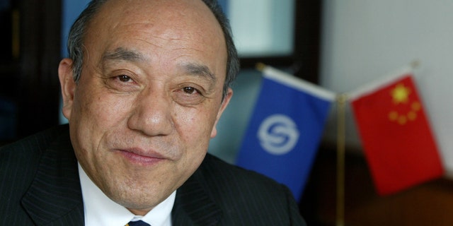 Feb. 21, 2004: Lu Guanqiu, board chairman of Wanxiang Group, sits in his office at the company's headquarters in Xiaoshan, China.