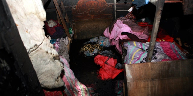 Jan. 4, 2013: A charred room with beds and beddings scattered after a fire at a private shelter for orphans and abandoned children in Lankao in central China's Henan province.