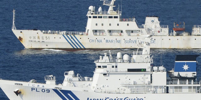 Oct. 25, 2012: Ships of China Marine Surveillance and Japan Coast Guard steam side by side near disputed islands, called Senkaku in Japan and Diaoyu in China, in the East China Sea.