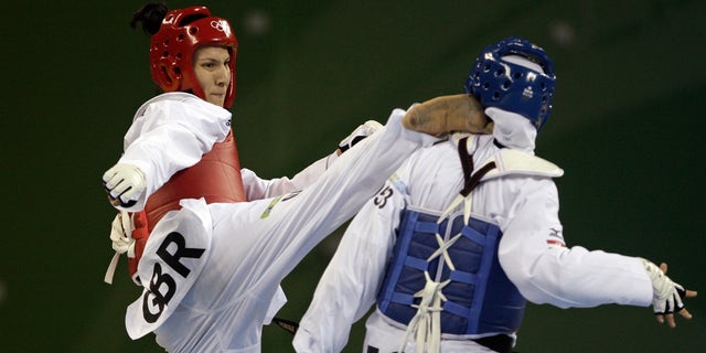 Aug. 23, 2008: Britain's Sarah Stevenson, left, fights with Egypt's Noha Abd Rabo in a bronze medal match for the women's taekwondo +67 kilogram class at the Beijing 2008 Olympics in Beijing.