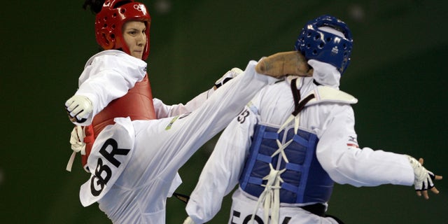 Aug. 23, 2008: Britain's Sarah Stevenson, left, fights with Egypt's Noha Abd Rabo in a bronze medal match for the women's taekwondo +67 kilogram class at the Beijing 2008 Olympics in Beijing.