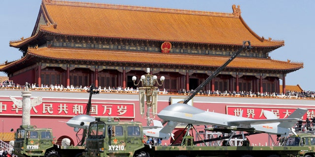 Sept. 3, 2015: Chinese military vehicles carry Pterodactyl I unmanned aerial vehicles past the Tiananmen Gate during a military parade to commemorate the 70th anniversary of the end of World War II in Beijing. (Jason Lee/Pool Photo via AP)