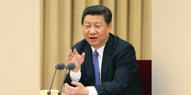 In this photo released by China's Xinhua News Agency, Chinese President Xi Jinping addresses a high-level party meeting that sought to unite non-Communist Party groups and individuals in Beijing Wednesday, May 20, 2015. Xi warned that religions must be independent from foreign influence, as the government asks domestic religious groups to pledge loyalty to the state. China is ruled by the officially atheist Communist Party, and Beijing attempts to control a variety of religions and their spread. (Ma Zhancheng/XInhua via AP) NO SALES