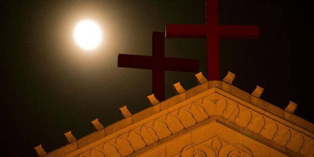 In eastern China's Zhejiang Province church members are keeping a 24-hour vigil to watch for Chinese government workers coming to remove the building's crosses.