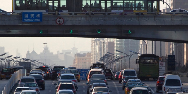 Dec. 23, 2010: Vehicles pack the main roads during the day in central Beijing, China.