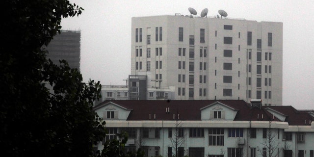 May 31, 2013: This file photo shows the building housing Unit 61398 of the Peoples Liberation Army, center top, on the outskirts of Shanghai, China. A U.S. security firm, Mandiant, said last year it traced attacks on American and other companies to the military unit in Shanghai. China on Tuesday, May 20, 2004, warned the United States was jeopardizing military ties by charging five Chinese officers with cyberspying and tried to turn the tables on Washington by calling it "the biggest attacker of China's cyberspace." (AP)