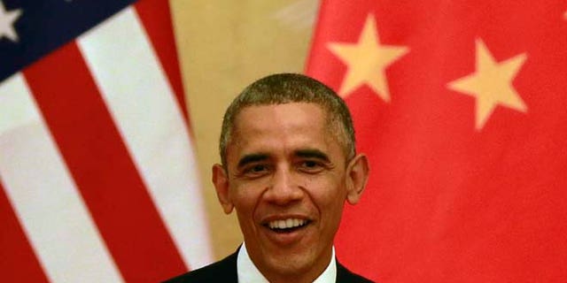 This Wednesday, Nov. 12, 2014 photos shows U.S. President Barack Obama during a joint press conference with Chinese President Xi Jinping at the Great Hall of the People in Beijing.