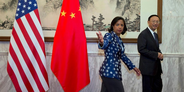 September 8, 2014: U.S. National Security Advisor Susan Rice, left, gestures as she walks with Chinese State Councilor Yang Jiechi, right, before a meeting at the Diaoyutai State Guesthouse in Beijing. (AP Photo/Ng Han Guan, Pool)