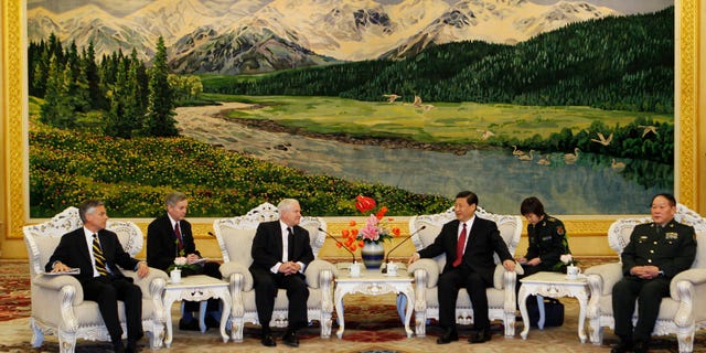 Jan. 10, 2011: U.S. Secretary of Defense Robert Gates, third from left, and Chinese Vice President Xi Jinping, third from right, sit with members of their delegation during a meeting at the Great Hall of the People in Beijing. (AP)