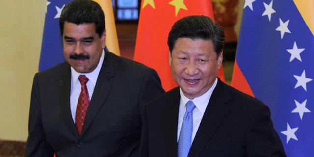 Chinese President Xi Jinping meets with Venezuela's President Nicolas Maduro at the Great Hall of the People September 1, 2015 in Beijing, China. (Photo by Parker Song-Pool/Getty Images)