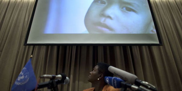 Oct. 21, 2011: Valerie Amos, U.N. undersecretary-general for Humanitarian Affairs and Emergency Relief Coordinator, looks at an image showing a North Korean child during a press conference in Beijing, China.