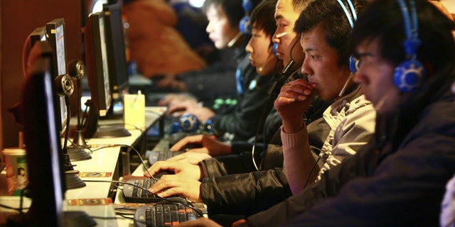 Chinese Web surfers browse the Internet in a local cybercafe.