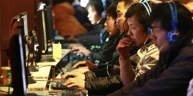Chinese Web surfers browse the Internet in a local cybercafe.