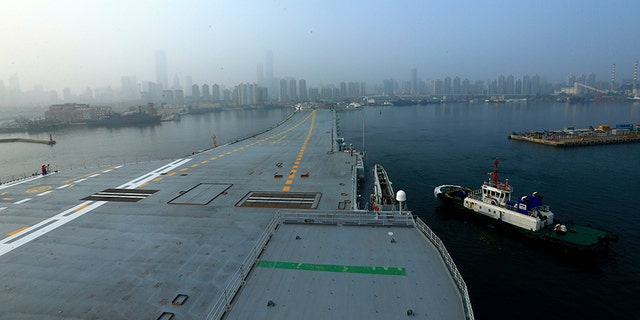 In this photo provided by China's Xinhua News Agency, China's aircraft carrier leaves Dalian in northeast China's Liaoning Province for sea trials Sunday, May 13, 2018.