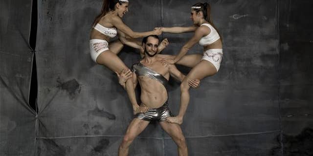 In this Sept. 16, 2016 picture, Ana Sofia Bigliardo and Ana Laura Ruzicka get in position for a souvenir picture with Poland's Dave Skda at the Romania Pole Sport&Fitness World Championship in Bucharest, Romania. This is the time of year when people are most likely to weigh their lowest all year.