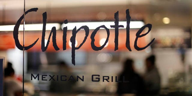 This Sunday, Dec. 27, 2015, photo, shows a Chipotle restaurant at Union Station in Washington. Chipotle said Wednesday, Jan. 6, 2016, it has been served with a federal grand jury subpoena as part of a criminal investigation tied to a norovirus outbreak this summer at one of its restaurants in California. (AP Photo/Gene J. Puskar)