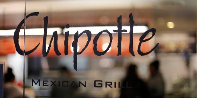 This Sunday, Dec. 27, 2015, photo, shows a Chipotle restaurant at Union Station in Washington. Chipotle said Wednesday, Jan. 6, 2016, it has been served with a federal grand jury subpoena as part of a criminal investigation tied to a norovirus outbreak this summer at one of its restaurants in California. (AP Photo/Gene J. Puskar)