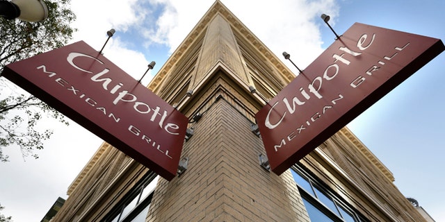 Signage hangs from a closed Chipotle restaurant in Portland, Ore., Monday, Nov. 2, 2015. Chipotle voluntarily closed down 43 of its locations in Washington and the Portland area as a precaution after an E. coli outbreak linked to six of its restaurants in the two states has sickened nearly two dozen people. (AP Photo/Don Ryan)
