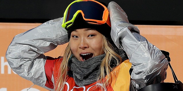 Chloe Kim, of the United States, reacts to her score during the women's halfpipe finals at Phoenix Snow Park at the 2018 Winter Olympics in Pyeongchang, South Korea, Tuesday, Feb. 13, 2018.