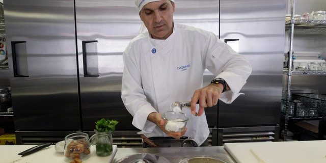 July 23, 2012: Dar Vasseghi, director of retail concepts at Chobani, prepares one of the bar's creations at the Chobani yogurt bar in the Soho neighborhood of New York.