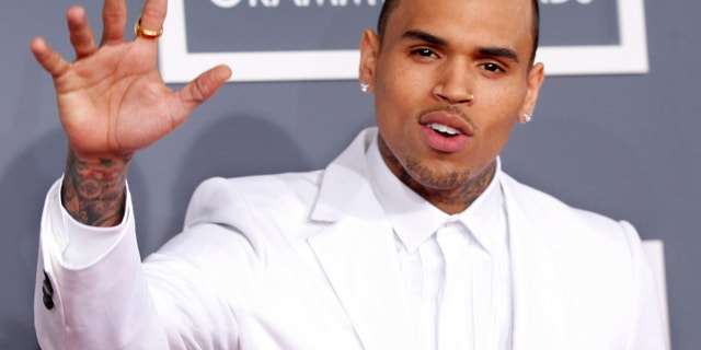Chris Brown arrives at the 55th annual Grammy Awards.