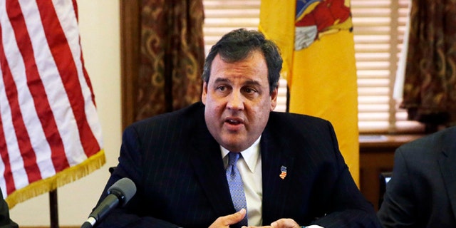 New Jersey Gov. Chris Christie, center, meets with members of his Cabinet at the Statehouse in Trenton, N.J., Tuesday, Nov. 12, 2013. (AP Photo/Mel Evans)