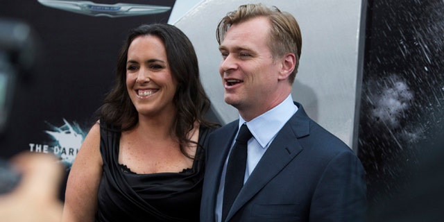 July 16, 2012: Director Christopher Nolan (R) and wife Emma Thomas attend the world premiere of the movie "The Dark Knight Rises" in New York.