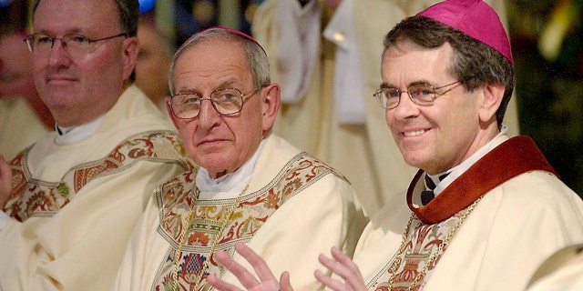 Bishop George Thomas, right, in a June 4, 2004 file photo.