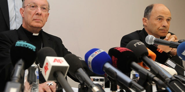 April 23, 2010: Belgium's Archbishop Andre-Joseph Leonard, left, and commission chairman Peter Adriaenssens address the media in Brussels about the sexual abuse by a Bishop. (AP Photo)