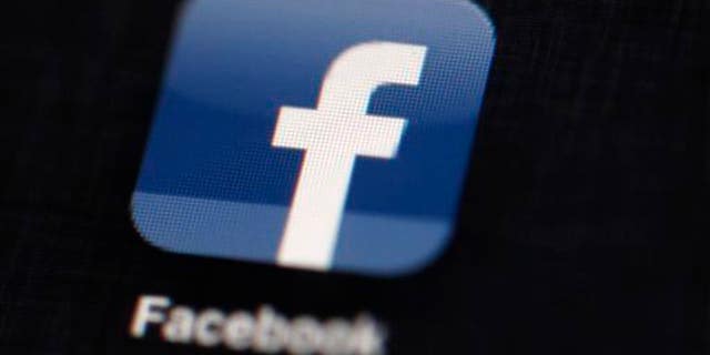 This May 16, 2012 file photo shows the Facebook logo displayed on an iPad in Philadelphia.