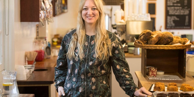 Claire Ptak, owner of Violet Bakery in Hackney, east London Tuesday March 20, 2018. Ptak has been chosen to make the cake for the wedding in May of Prince Harry and Meghan Markle. Kensington Palace said Tuesday the royal wedding cake will be a lemon elderflower concoction incorporating "the bright flavors of spring."