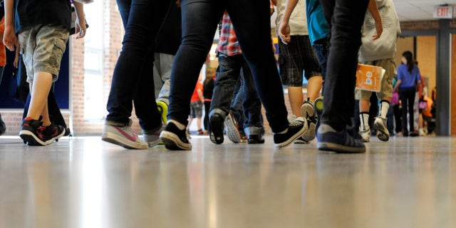 Sept. 11, 2012: File photo, students walk in the hallways as they enter the lunch line of the cafeteria at Draper Middle School in Rotterdam, N.Y. School for thousands of public school students is about to get quite a bit longer. Five states announced Monday, Dec. 3, 2012, they will add at least 300 hours of learning time to the calendar in some schools starting in 2013.