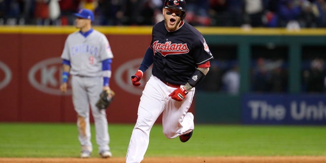 CLEVELAND, OH - OCTOBER 25: Roberto Perez #55 of the Cleveland Indians reacts as he runs the bases after hitting a three-run home run during the eighth inning against the Chicago Cubs in Game One of the 2016 World Series at Progressive Field on October 25, 2016 in Cleveland, Ohio. (Photo by Jamie Squire/Getty Images)