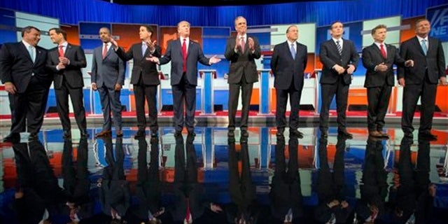Republican presidential candidates from left, Chris Christie, Marco Rubio, Ben Carson, Scott Walker, Donald Trump, Jeb Bush, Mike Huckabee, Ted Cruz, Rand Paul, and John Kasich take the stage for the first Republican presidential debate at the Quicken Loans Arena, Thursday, Aug. 6, 2015, in Cleveland. (AP Photo/Andrew Harnik)