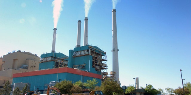 In this July 1, 2013, file photo, smoke rises from the Colstrip Steam Electric Station, a coal burning power plant in in Colstrip, Mont.