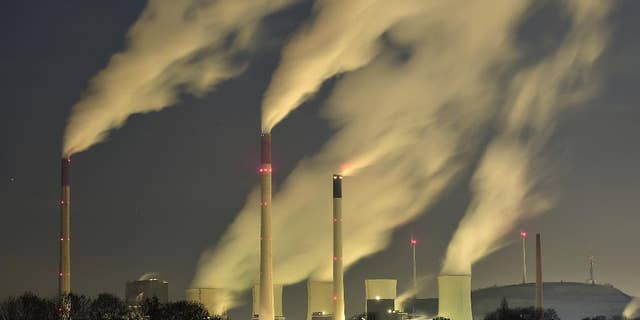FILE - In this Nov. 24, 2014 file photo, smoke streams from the chimneys of the E.ON coal-fired power station in Gelsenkirchen, Germany. The U.N. weather agency says levels of carbon dioxide and methane, the two most important greenhouse gases, reached record highs last year. Pushed by the burning of coal, oil and gas for energy, global CO2 levels are now 143 percent higher than before the industrial revolution and scientists say that’s the main driver of global warming. (AP Photo/Martin Meissner, File)