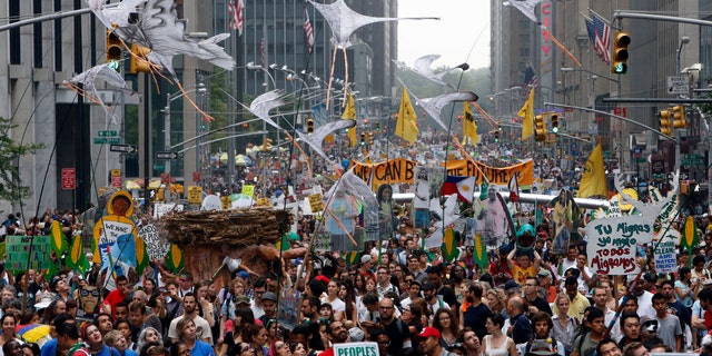 Demonstrators make their way down Sixth Avenue in New York during the People's Climate March.