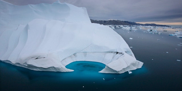 Scientists who are fine-tuning a landmark U.N. report on climate change are struggling to explain why global warming appears to have slowed down in the past 15 years even as greenhouse gas emissions keep rising.